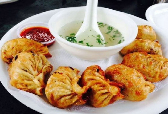 Pan Fried Chicken Momos with Fried Rice and Sauce